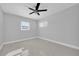 Simple bedroom with ceiling fan and neutral walls at 5808 Dartmouth N Ave, St Petersburg, FL 33710