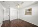 Bedroom with dark wood floors, a window, and a double door closet at 5857 25Th S St, St Petersburg, FL 33712
