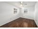 Well-lit bedroom with dark wood floors and two windows at 5857 25Th S St, St Petersburg, FL 33712