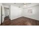 Bedroom with dark wood floors and access to another room at 5857 25Th S St, St Petersburg, FL 33712
