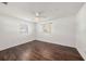 Bright bedroom with dark wood floors and two windows at 5857 25Th S St, St Petersburg, FL 33712
