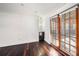 Bonus room with wood floors, built-in shelving, and French doors at 5857 25Th S St, St Petersburg, FL 33712