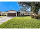 Charming ranch home with a well-manicured lawn and mature trees at 5857 25Th S St, St Petersburg, FL 33712