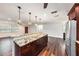 Renovated kitchen featuring granite countertops and dark wood cabinets at 5857 25Th S St, St Petersburg, FL 33712