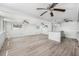 Spacious living room offers abundant natural light, multiple fans, and a breakfast bar at 5857 25Th S St, St Petersburg, FL 33712