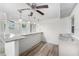 Open-concept living area with a marble counter, white walls, and recessed lighting at 5857 25Th S St, St Petersburg, FL 33712