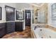 Spa-like bathroom with soaking tub, walk-in shower, and closet at 730 June Lake Ln, Brandon, FL 33510