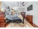 Spacious main bedroom with a king-size bed and wood floors at 730 June Lake Ln, Brandon, FL 33510