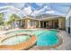 Inviting pool and spa with screened enclosure at 730 June Lake Ln, Brandon, FL 33510