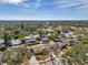 Aerial view showing home's location in a residential neighborhood with mature trees at 9126 109Th Ter, Seminole, FL 33777