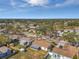 Aerial view of a residential street with houses, yards, and tree-lined streets at 9126 109Th Ter, Seminole, FL 33777