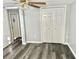 Bedroom with double door closet and wood-look flooring at 9790 66Th N St # 74, Pinellas Park, FL 33782