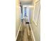 Hallway with wood-look flooring and light gray walls at 9790 66Th N St # 74, Pinellas Park, FL 33782