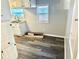 Bright kitchen with white cabinets and wood-look flooring at 9790 66Th N St # 74, Pinellas Park, FL 33782