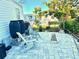Peaceful patio with stone pavers and wooden chairs at 9790 66Th N St # 74, Pinellas Park, FL 33782