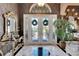 Elegant entryway featuring double doors and a large mirror at 10002 Cherry Hills Ave, Bradenton, FL 34202