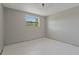 Simple bedroom with a window and neutral wall color at 1025 Fairwood Ave, Clearwater, FL 33759