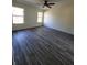 Bright bedroom with ceiling fan and vinyl wood flooring at 1302 E Annie St, Tampa, FL 33612