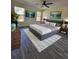 Large main bedroom with a king-size bed, stylish rug, and modern decor at 1302 E Annie St, Tampa, FL 33612