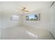 Bright bedroom with ceiling fan, closet and large window providing lots of natural light at 1388 S Hercules Ave, Clearwater, FL 33764