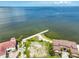 Gorgeous aerial view showcasing the waterfront homes, bay, and private pier at 1414 Alhambra Dr, Apollo Beach, FL 33572