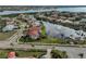 A stunning aerial view of a community that features homes surrounding a scenic lake at 1414 Alhambra Dr, Apollo Beach, FL 33572