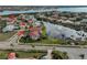 Aerial view of beautiful waterfront community featuring tile roofs and a large fountain at 1414 Alhambra Dr, Apollo Beach, FL 33572