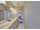 Bathroom view displaying a large vanity with double sinks, enhanced by an expansive mirror at 1414 Alhambra Dr, Apollo Beach, FL 33572