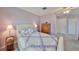 Cozy bedroom features a plush bed and a quaint nightstand with soft lighting at 1414 Alhambra Dr, Apollo Beach, FL 33572