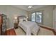 Bedroom with a large window, neutral walls and furnishings create a relaxing atmosphere at 1414 Alhambra Dr, Apollo Beach, FL 33572