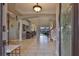 Bright open foyer featuring high ceilings, decorative columns, and tile flooring at 1414 Alhambra Dr, Apollo Beach, FL 33572