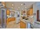 Kitchen featuring granite countertops, custom cabinets, and stainless steel appliances at 1414 Alhambra Dr, Apollo Beach, FL 33572
