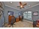 Home office with arched window, neutral walls, and ample desk space for a productive work environment at 1414 Alhambra Dr, Apollo Beach, FL 33572