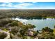 Aerial view of a house near a lake, showcasing the property's serene waterfront location at 1502 Cherrywood Ave, Tampa, FL 33613