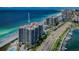 Aerial view of beachfront condo building with ocean and marina views at 1660 Gulf Blvd # 803, Clearwater Beach, FL 33767