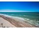 Aerial view showcasing pristine beach and ocean at 1660 Gulf Blvd # 803, Clearwater Beach, FL 33767