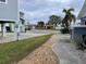 Landscaped walkway leading to neighborhood homes and waterfront at 17406 1St E St, Redington Shores, FL 33708