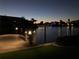 Night view of the canal and dock with lights at 17406 1St E St, Redington Shores, FL 33708