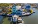 Aerial view of waterfront home with private dock at 17410 1St E St, Redington Shores, FL 33708