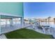 Relaxing patio with fire pit and waterfront views at 17410 1St E St, Redington Shores, FL 33708