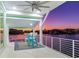 Waterfront balcony with sunset views and seating at 17410 1St E St, Redington Shores, FL 33708