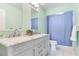 Modern bathroom with double vanity and marble countertop at 17410 1St E St, Redington Shores, FL 33708