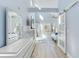 Sunlit bedroom with a view and modern dresser at 17410 1St E St, Redington Shores, FL 33708