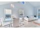 Casual dining area with water views, glass table, and white chairs at 17410 1St E St, Redington Shores, FL 33708