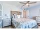 Comfortable guest bedroom with a plush bed and nightstand at 17410 1St E St, Redington Shores, FL 33708