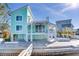 Charming teal home with spiral staircase and patio at 17410 1St E St, Redington Shores, FL 33708