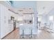 Modern white kitchen with stainless steel appliances and island at 17410 1St E St, Redington Shores, FL 33708