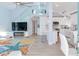 Open living area with modern kitchen, stairs, and water views at 17410 1St E St, Redington Shores, FL 33708