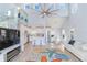 Open living space featuring a kitchen, dining area, and comfortable seating at 17410 1St E St, Redington Shores, FL 33708