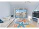 Living room features water views and a starfish rug at 17410 1St E St, Redington Shores, FL 33708